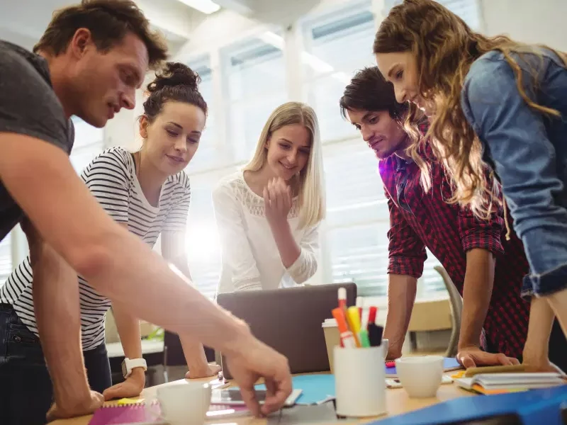 A creative team collaborating, representing Greenfields' corporate services for Start-Ups launching their business.