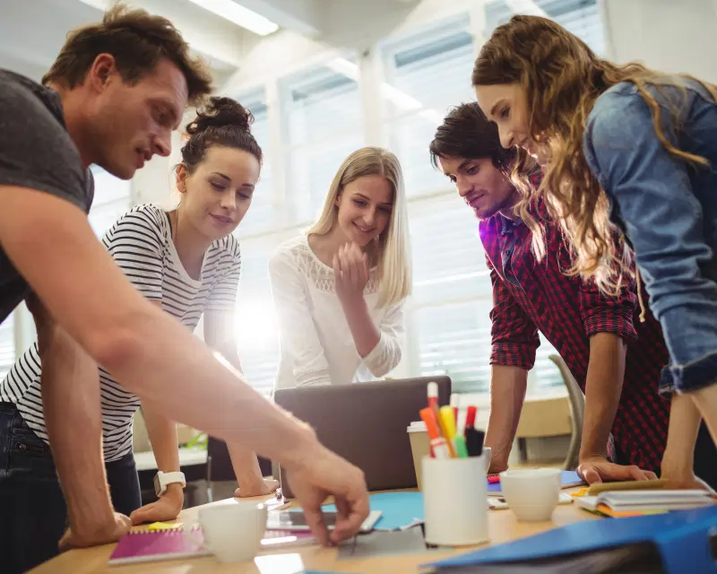 A creative team collaborating, representing Greenfields' corporate services for Start-Ups launching their business.