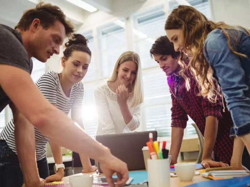 A creative team collaborating, representing Greenfields' corporate services for start-ups launching their business.